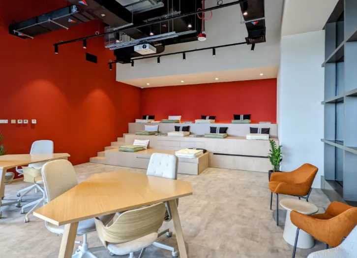 Site photo of the built multifunctional podium seating with integrated storage drawers